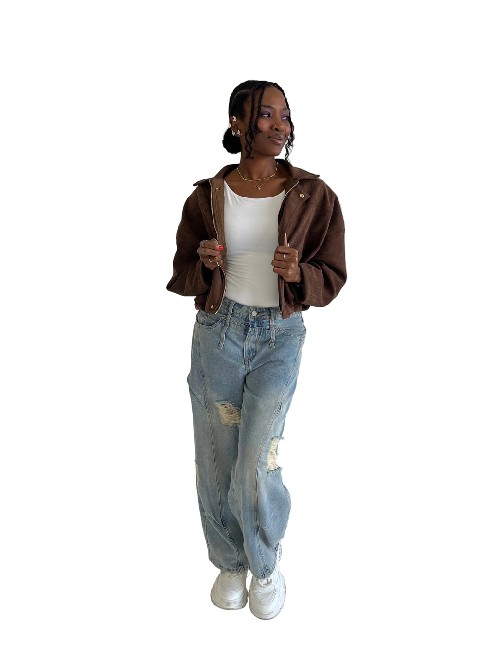 Person wearing a brown jacket, white shirt, and blue jeans against a plain background