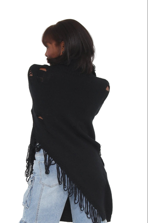 Person wearing light blue jeans and a black jacket on a white background